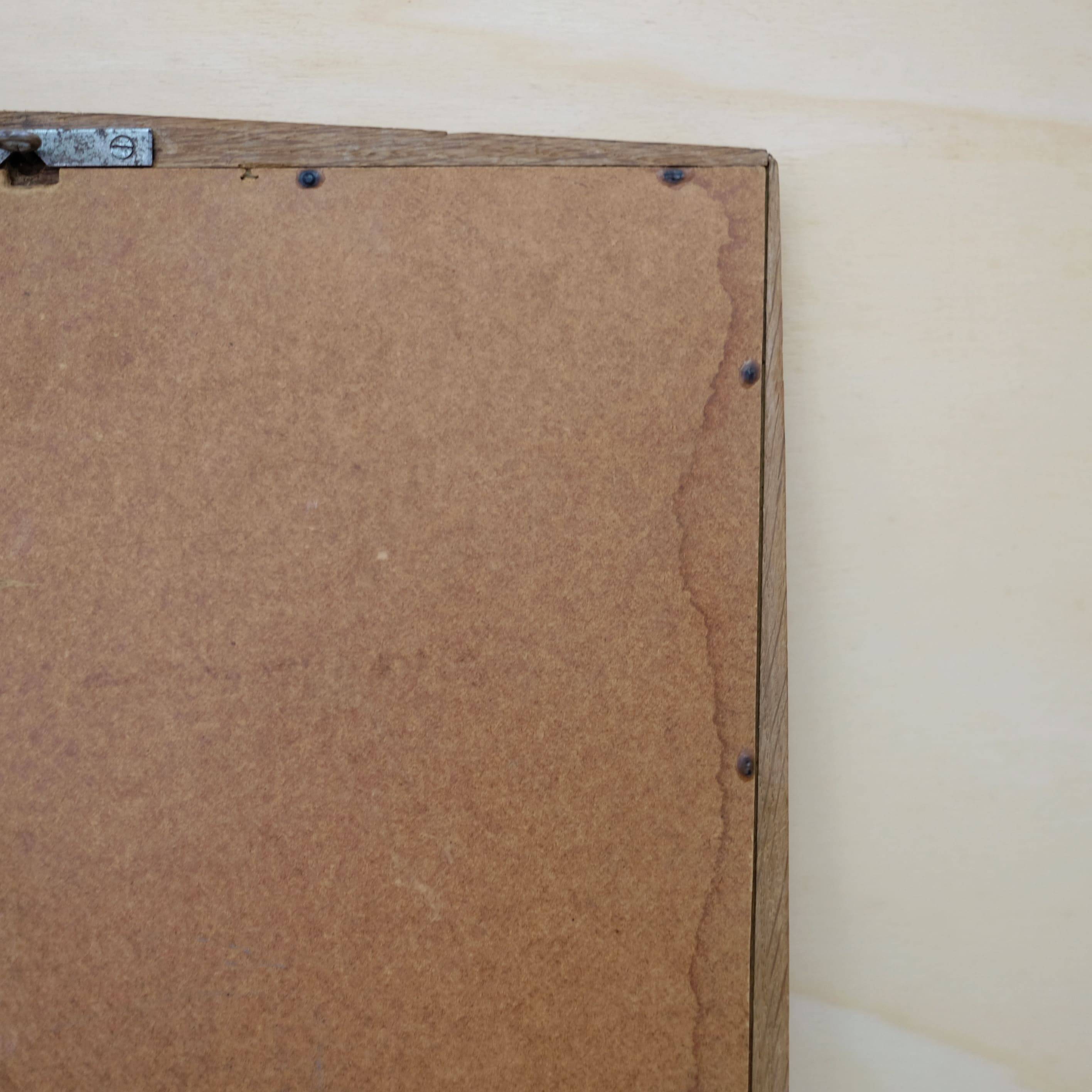 Miroir en chêne des années 60, 84 x 38.5 cm.