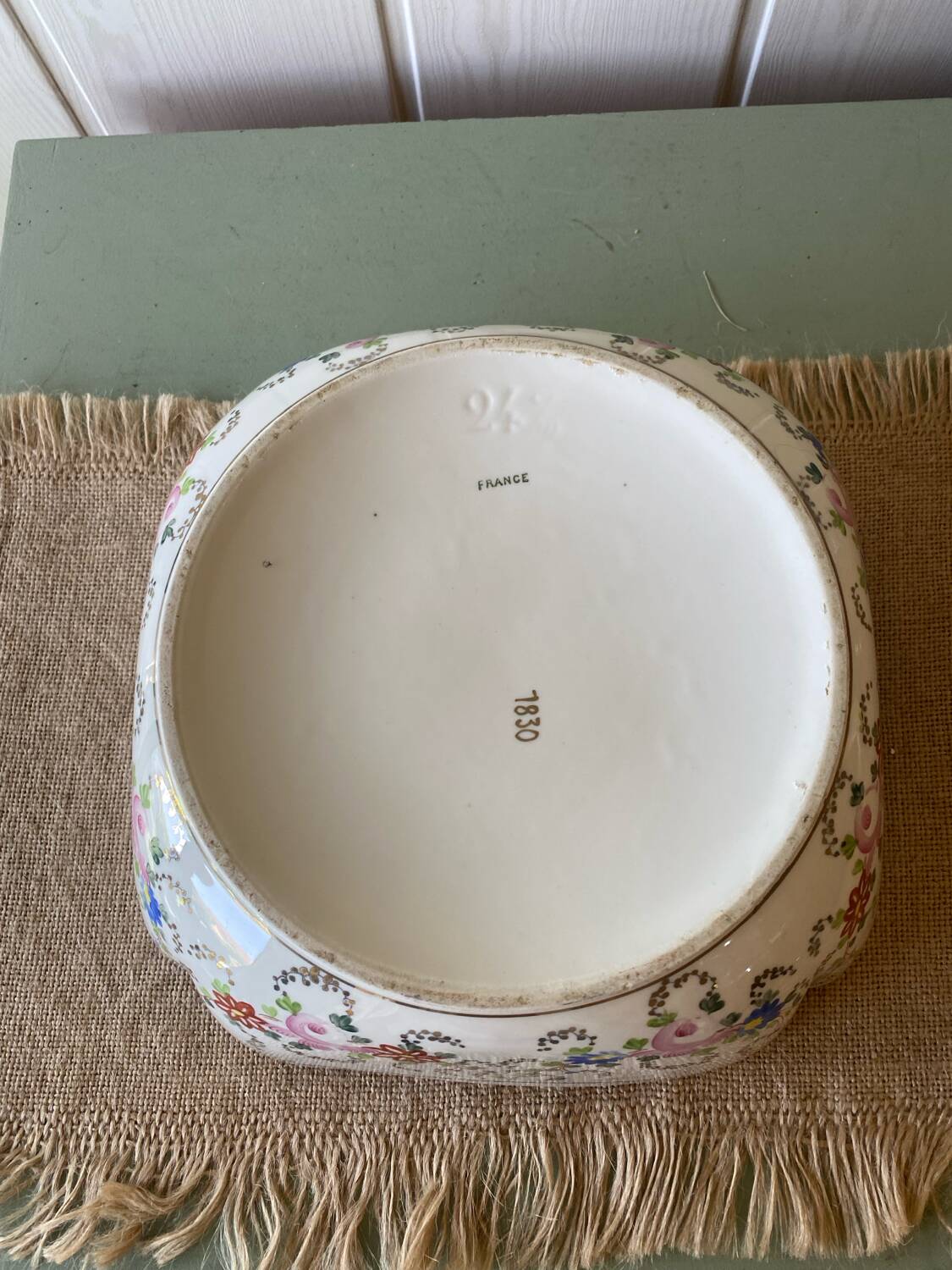 Old hollow porcelain dish with floral decoration and gold trim