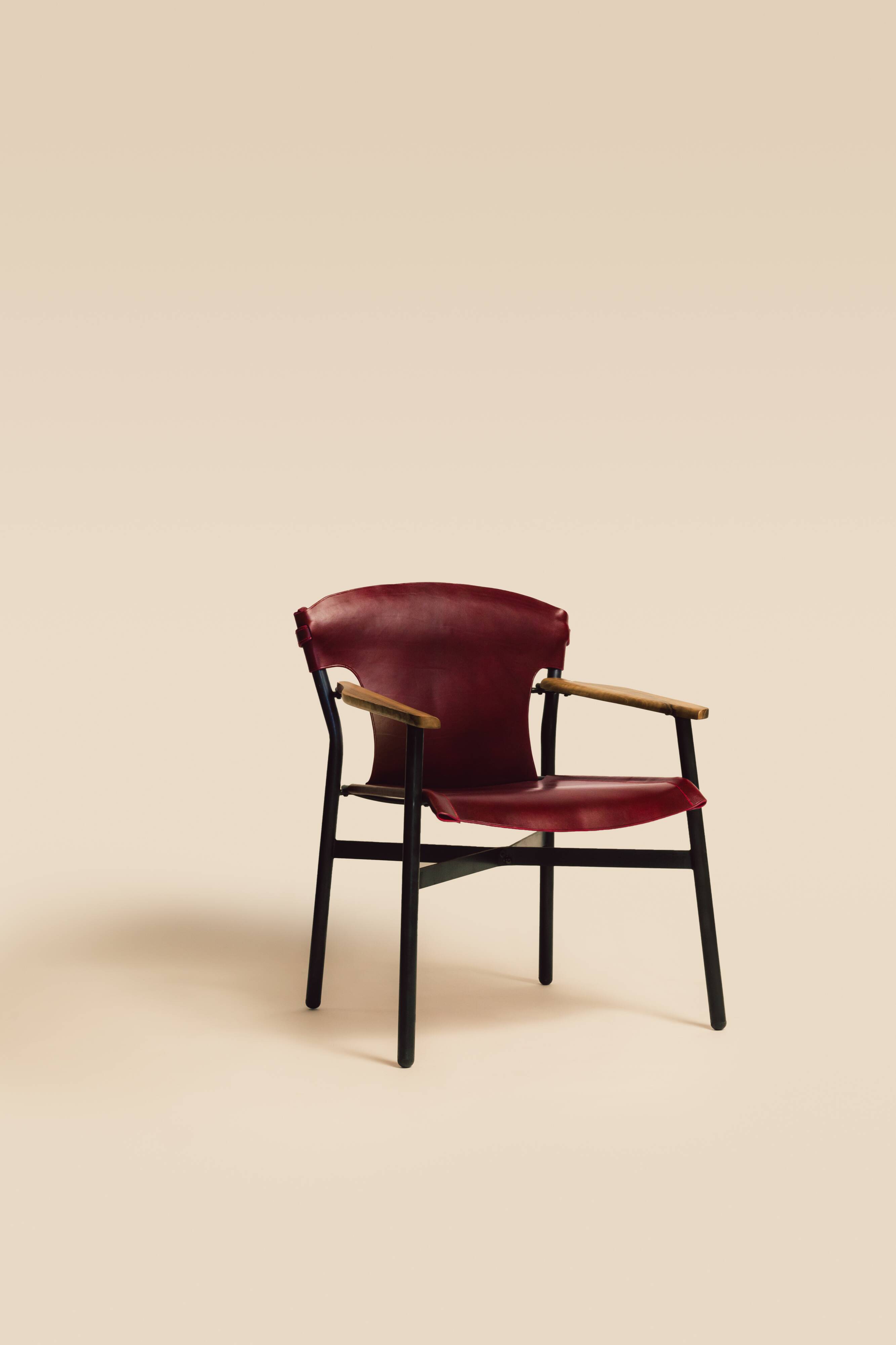 Maërl armchair, Galathée model, red leather, solid wood armrests of your choice