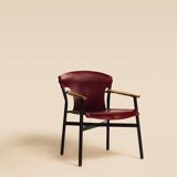 Maërl armchair, Galathée model, red leather, solid wood armrests of your choice