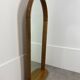 Miroir à tablette cerclage bois, forme ogive, années 60