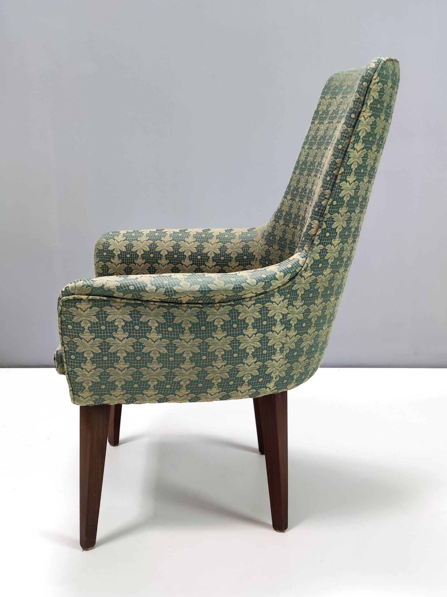 Green fabric and beech armchairs, italy