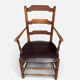 Antique rustic armchair in walnut and leather, 18th century.