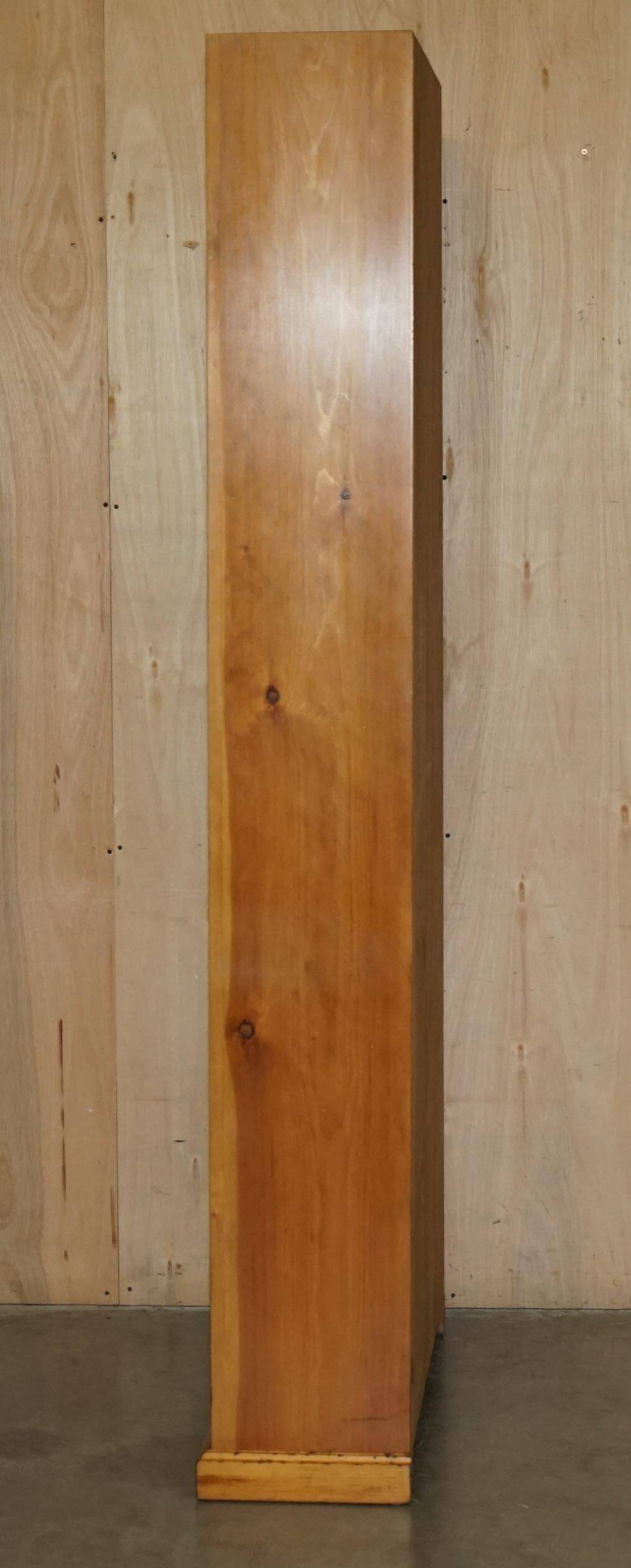 Pair of vintage cherry wood bookcases with lockable doors.