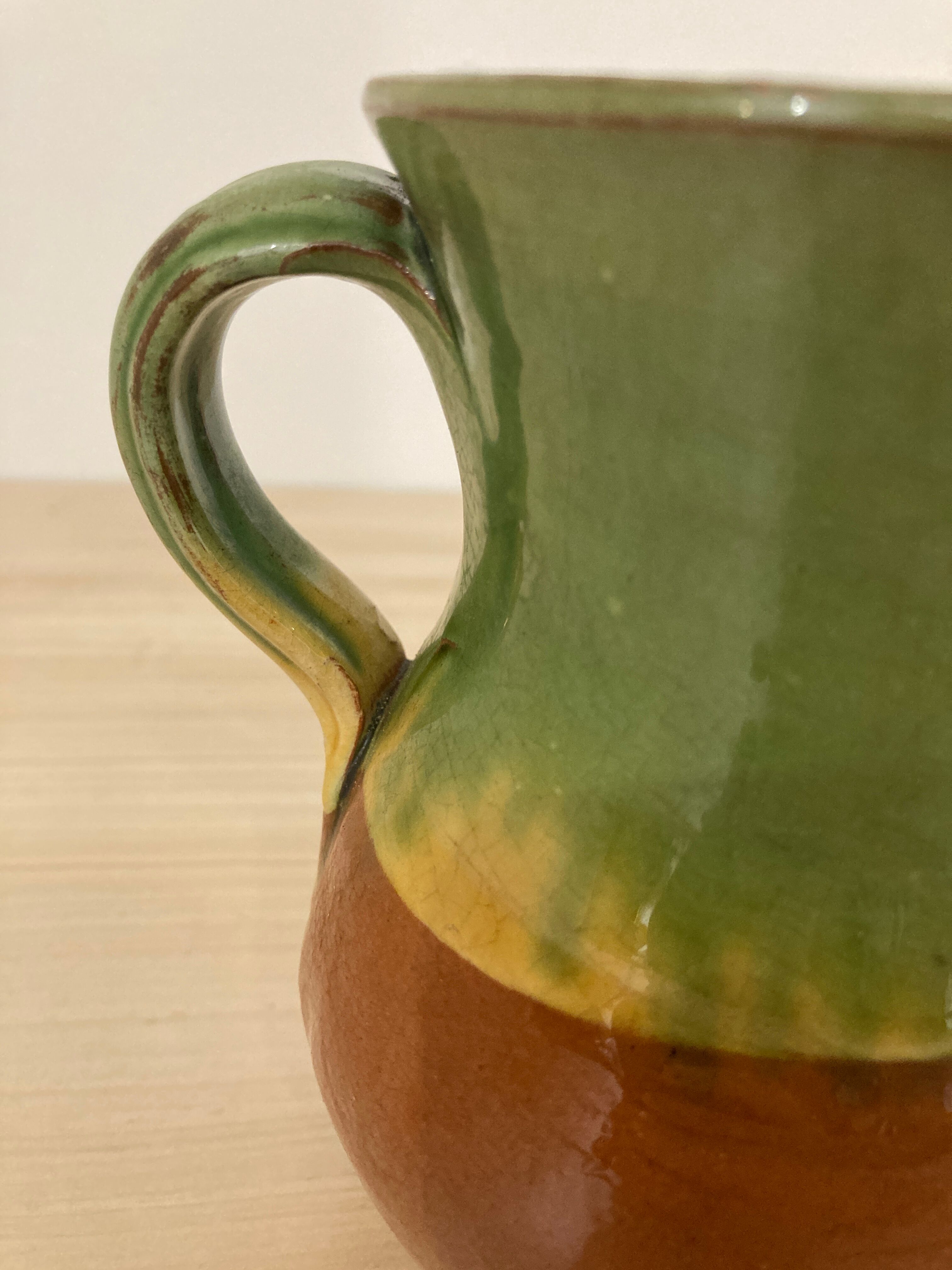 Green and brown ceramic pitcher