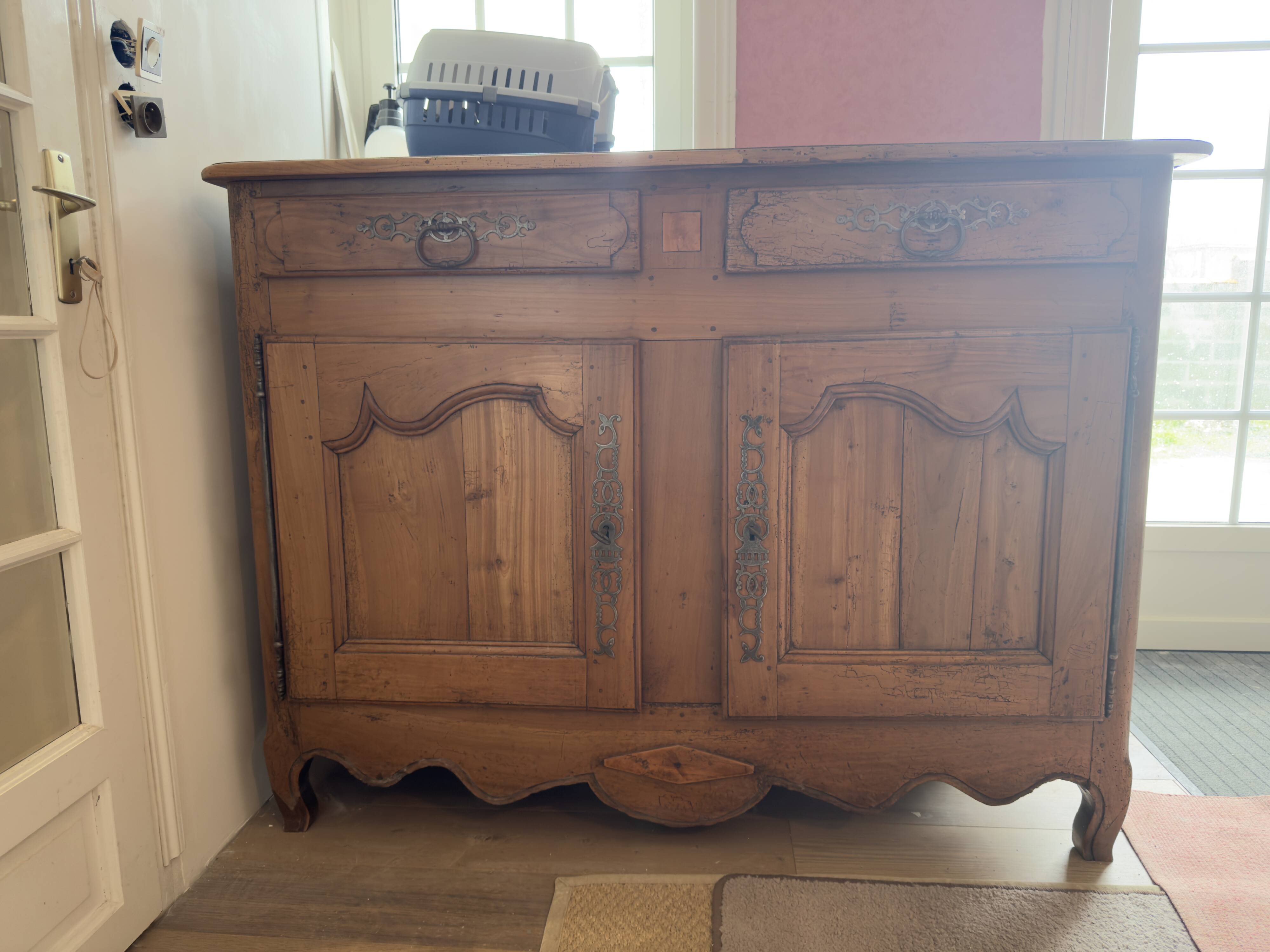 Very old, 2 doors, 2 drawers.