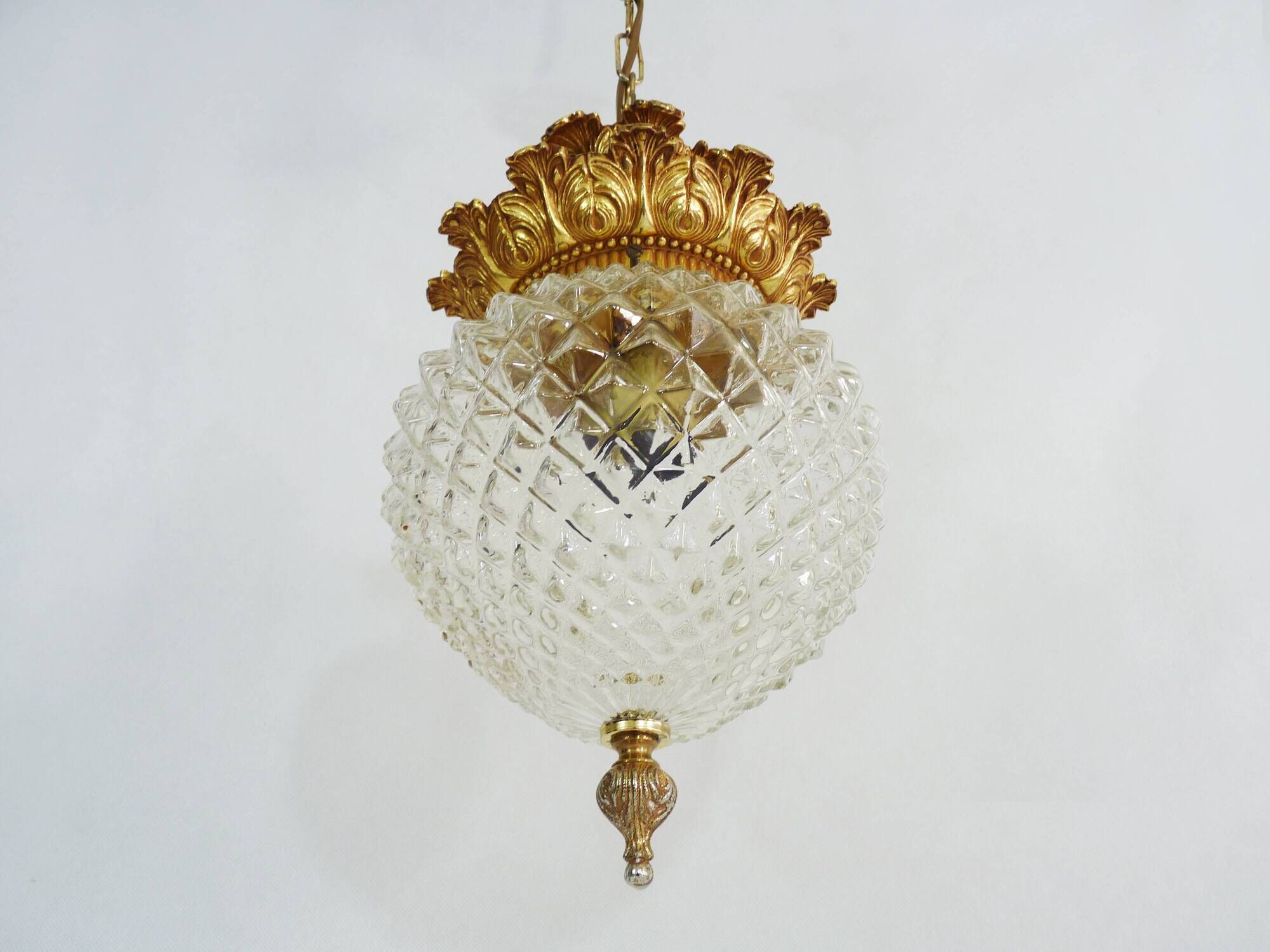 Brass and diamond-tipped chiseled glass globe hanging lamp
