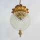 Brass and diamond-tipped chiseled glass globe hanging lamp