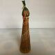 Multicoloured decorative mini bottle with gold metal.
