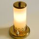 A beautiful, rare 1950s brass table lamp with one opal glass shade adorned