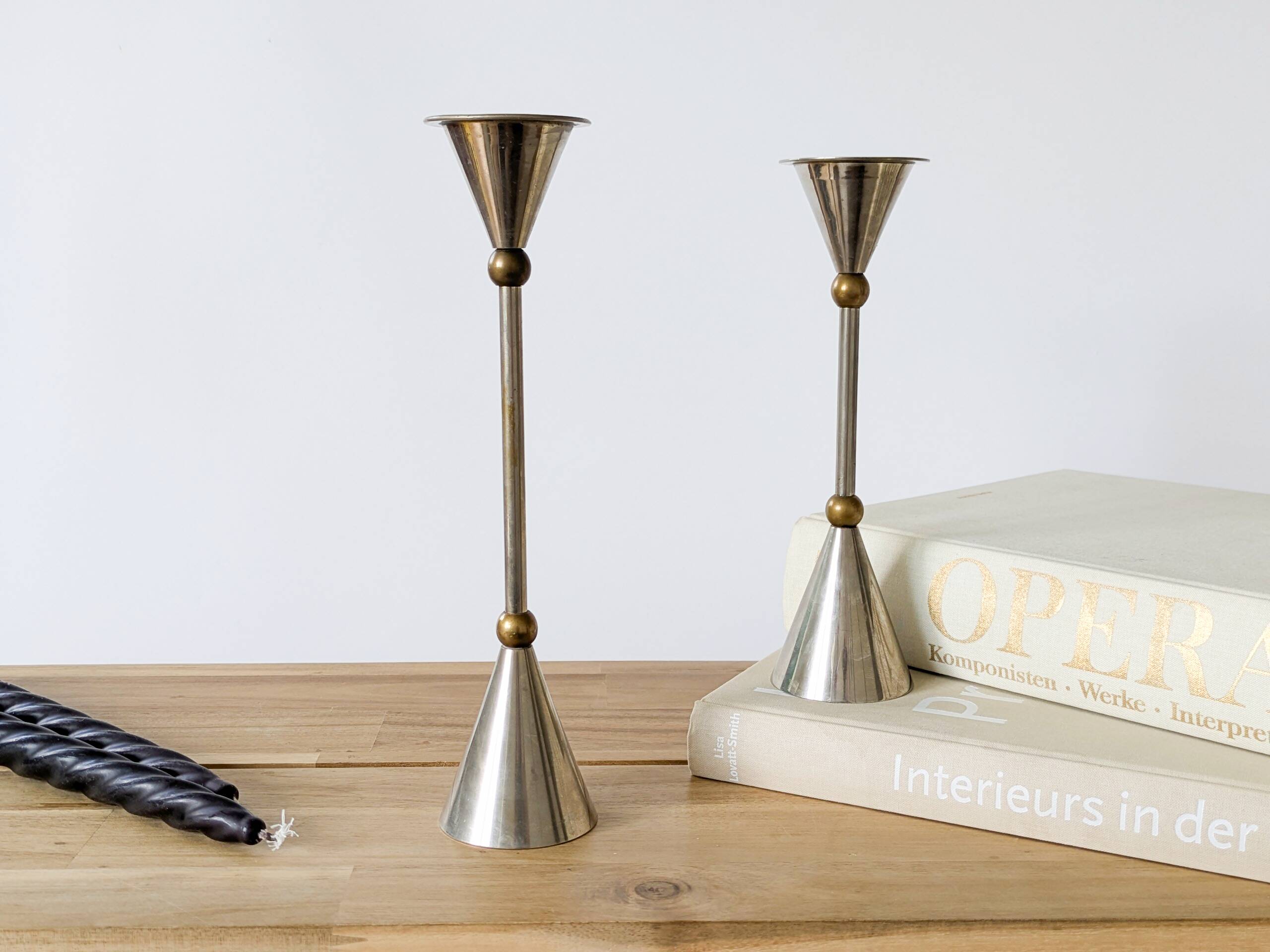 Pair of postmodern candlesticks in Memphis style made of steel and brass.