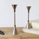 Pair of postmodern candlesticks in Memphis style made of steel and brass.