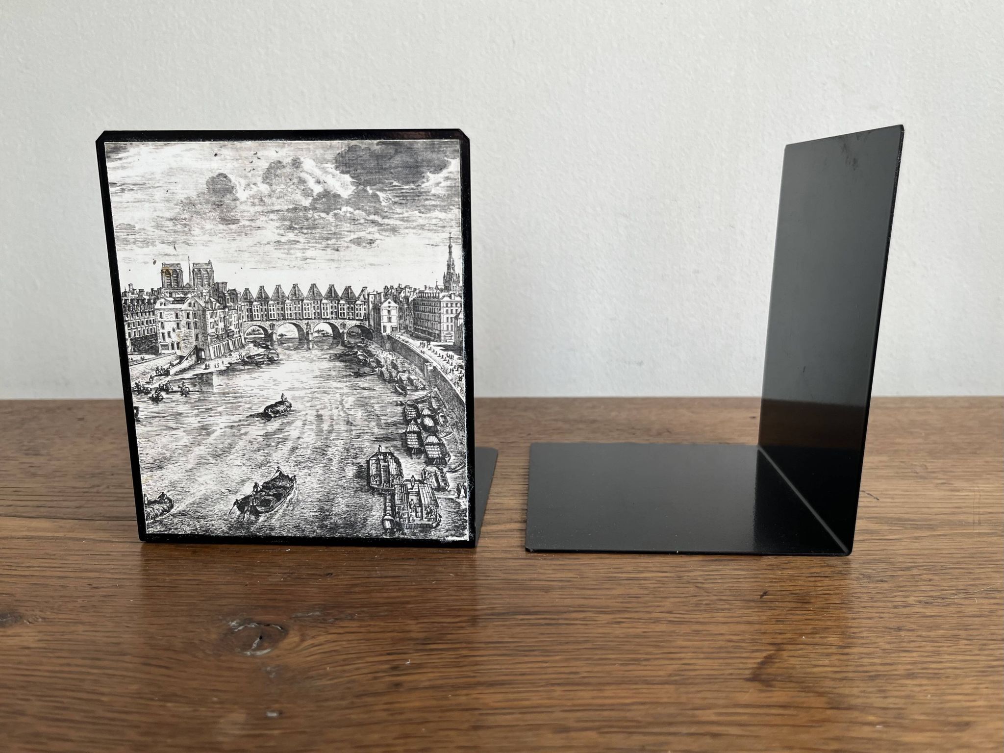 Bookends 1960 between Fornasetti's grey and Toile de Jouy views of Paris.