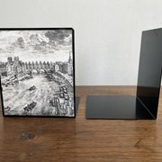 Bookends 1960 between Fornasetti's grey and Toile de Jouy views of Paris.