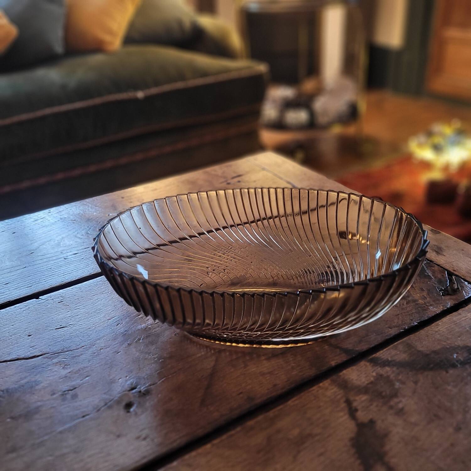 Smoked glass bowl with a radiating embossed pattern — 1970s