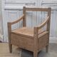 Antique armchair in raw wood