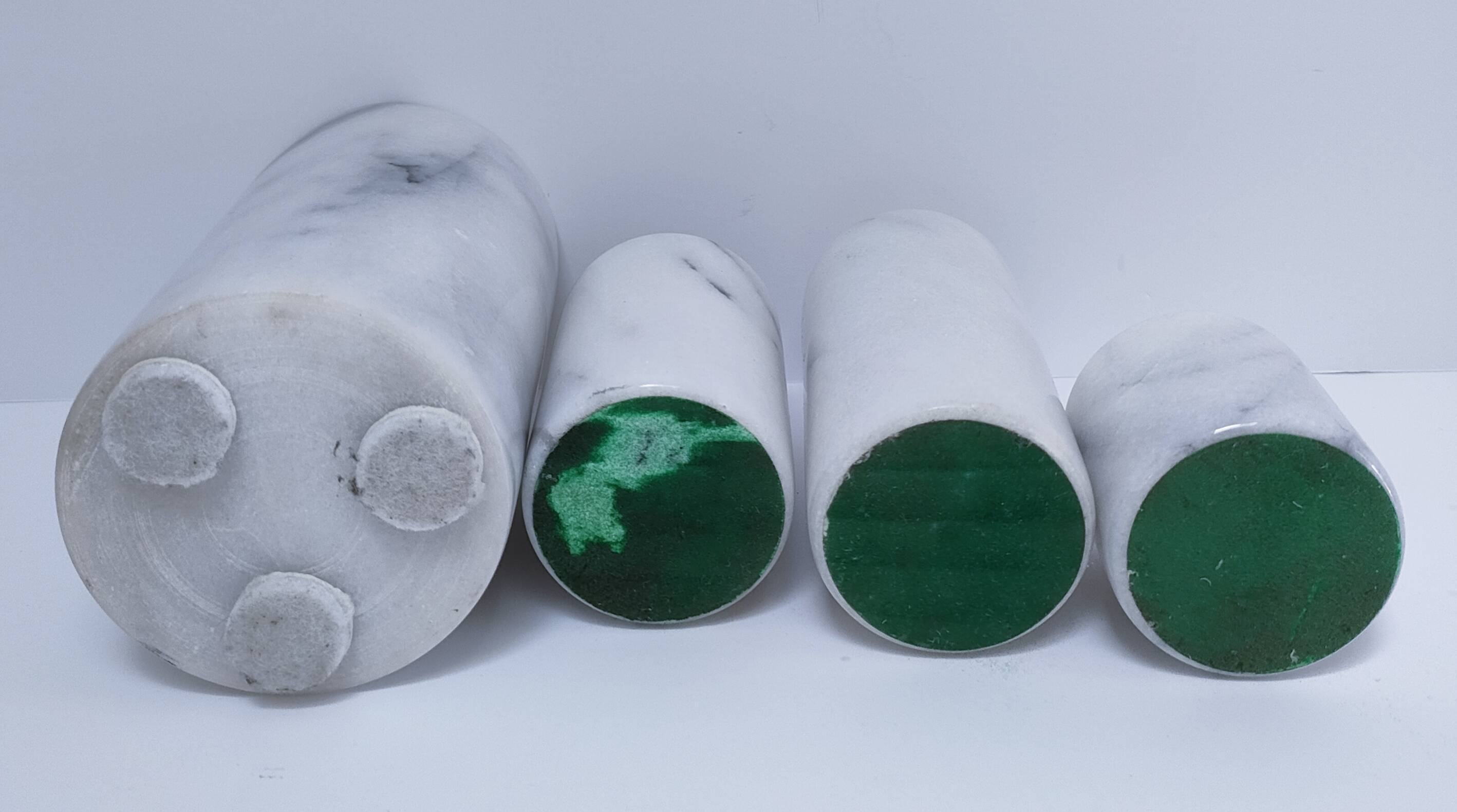 Four white marble candlesticks with black veins, 70s design