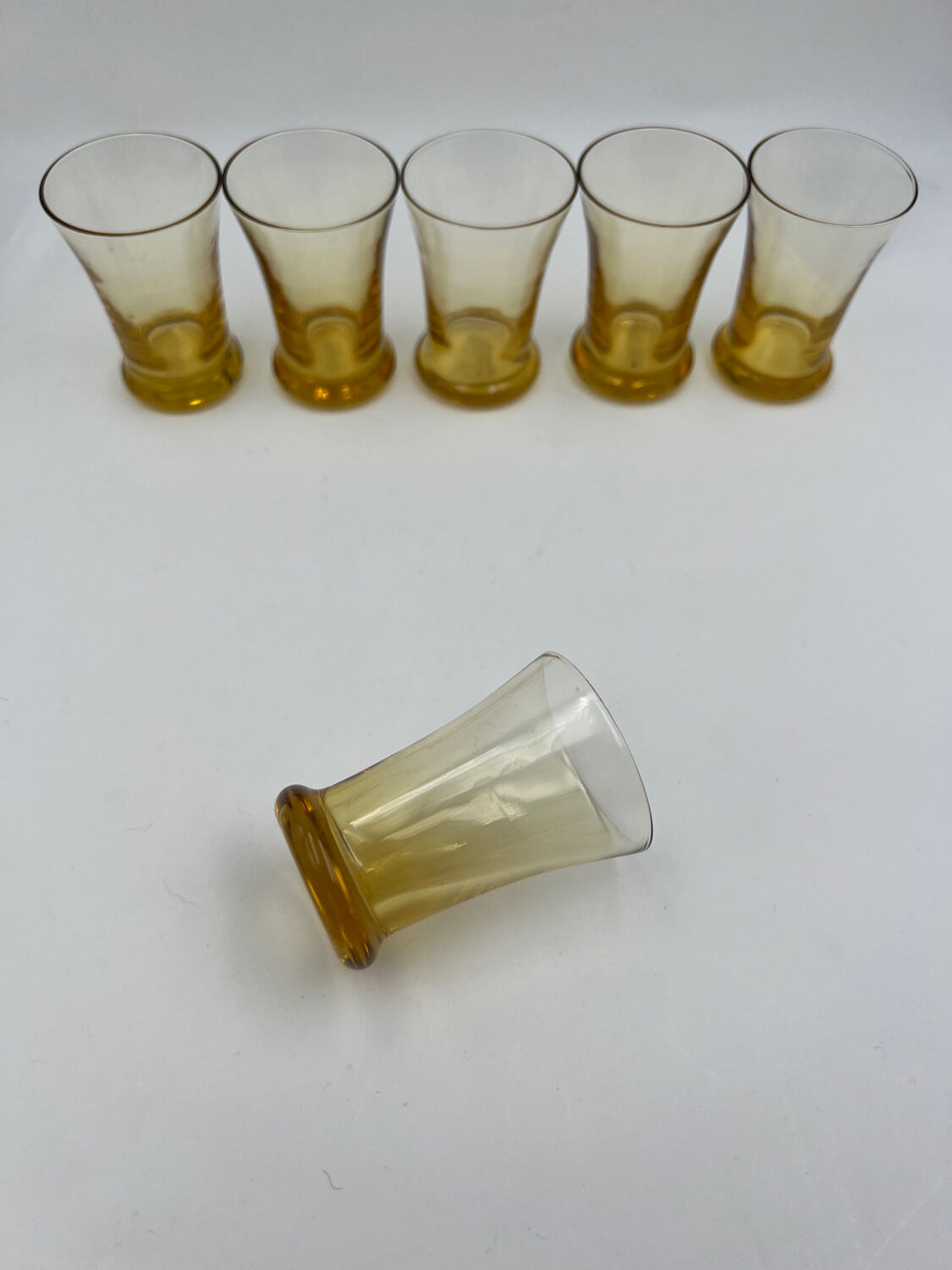 Six yellow glass shooting glasses