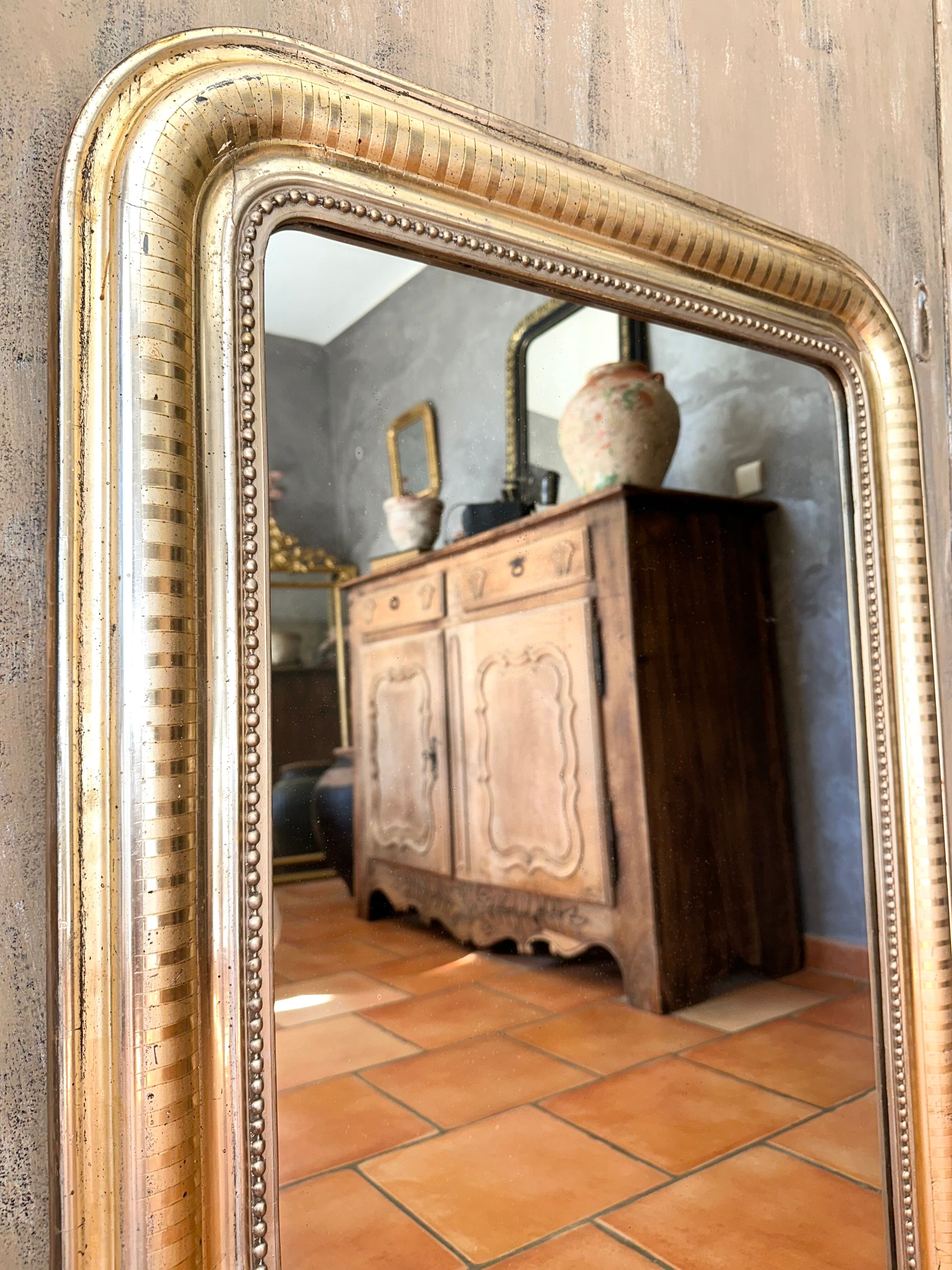 Louis-Philippe antique mirror with silver leaf, 19th century.