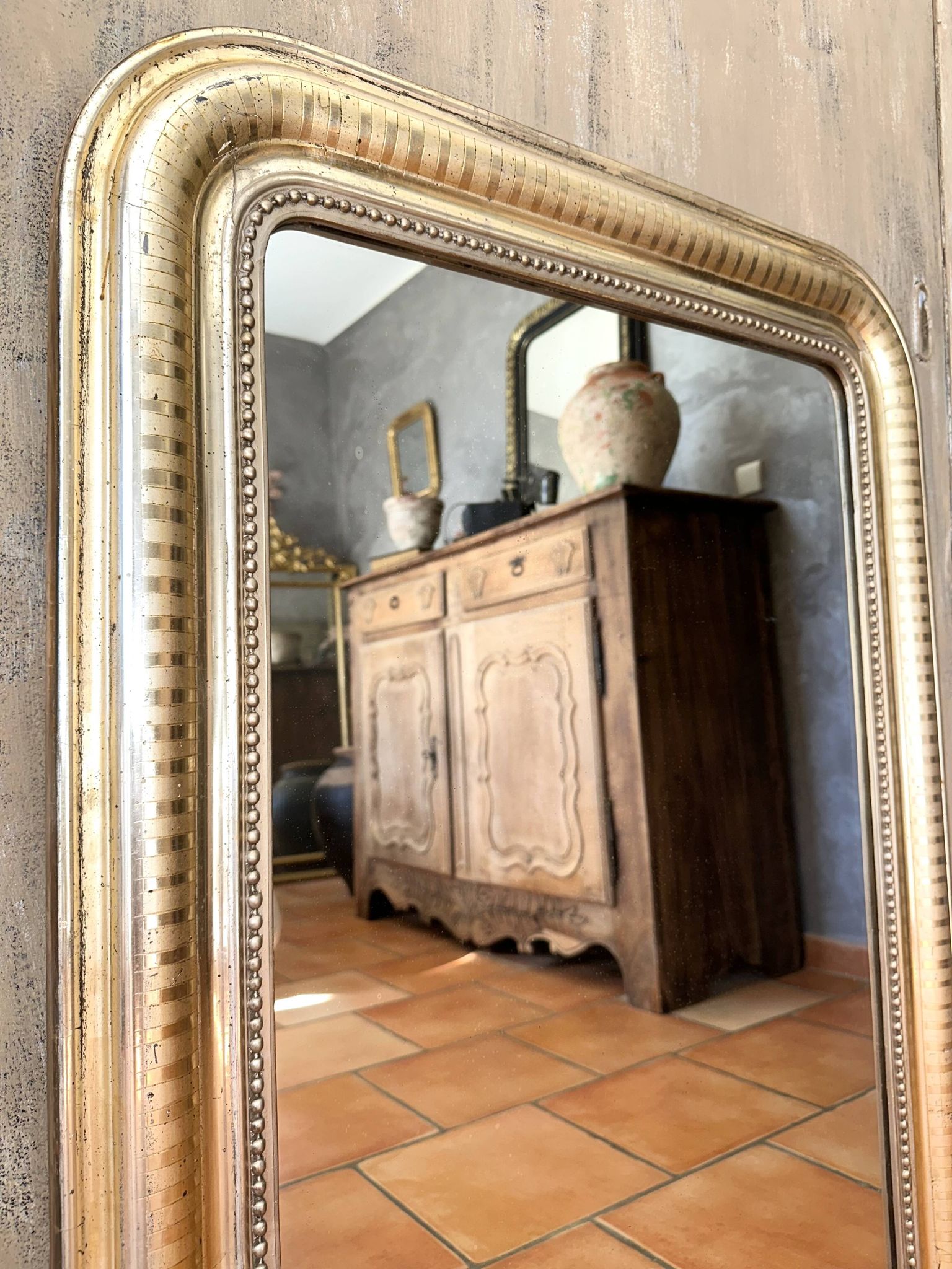 Louis-Philippe antique mirror with silver leaf, 19th century.