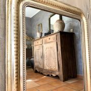 Louis-Philippe antique mirror with silver leaf, 19th century.