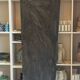 Long trapezoidal mirror in gilded brass, curved Art Deco modernist.