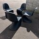 Set of 4 black Verner Panton Vitra chairs.