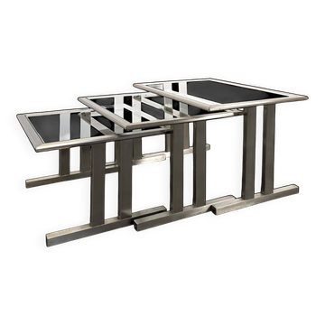 Nest of tables in chrome steel, space age style.