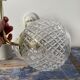 Set of two new electrified chiseled glass globe sconces