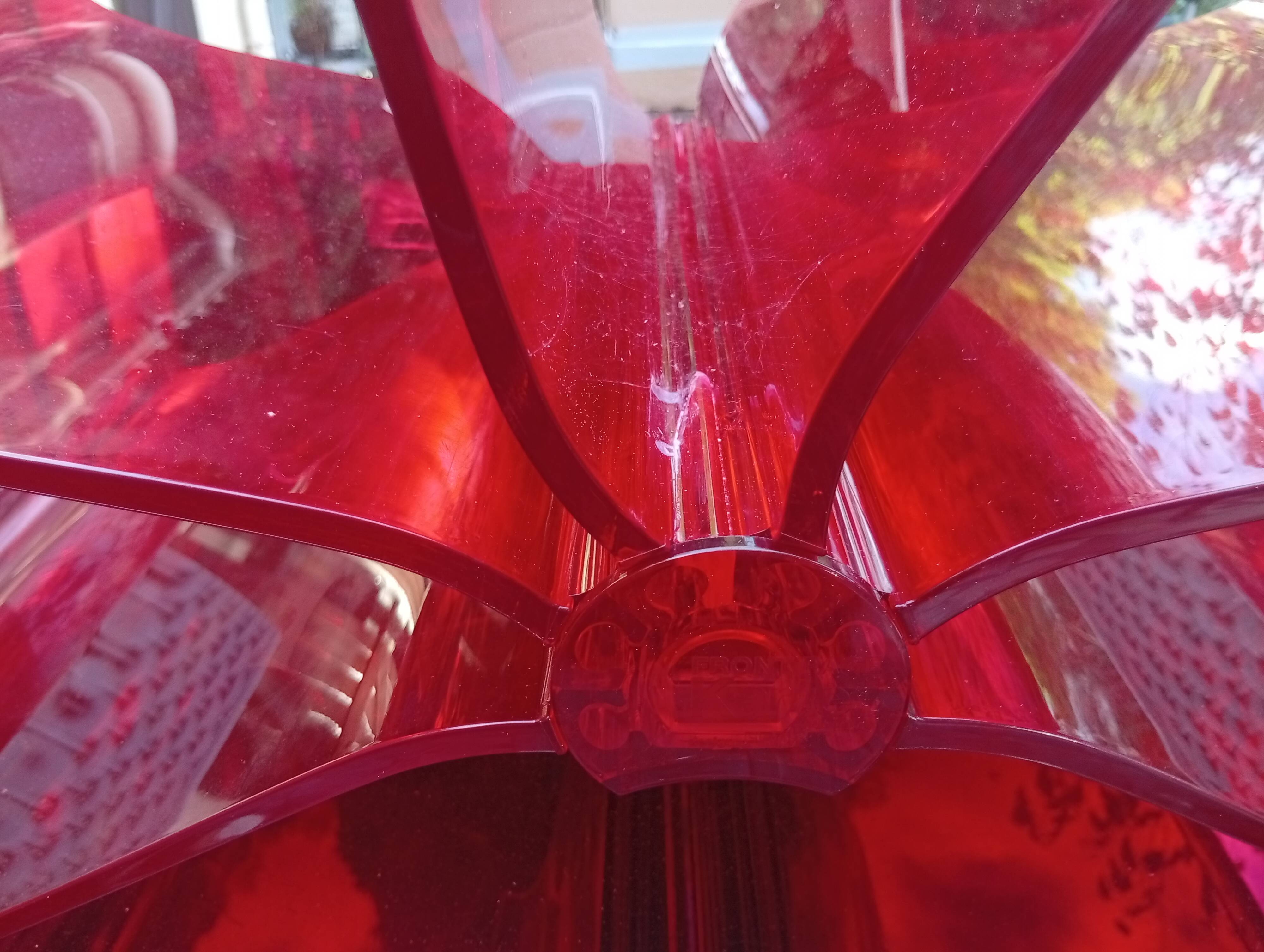 Kartell red magazine rack