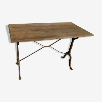 Antique bistro table with cast iron legs and wooden top