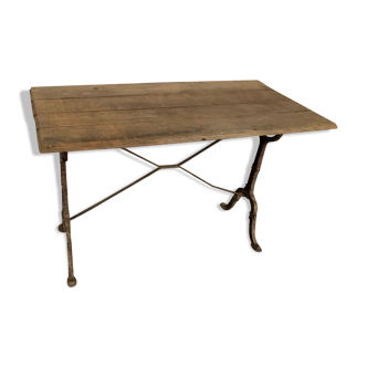 Antique bistro table with cast iron legs and wooden top