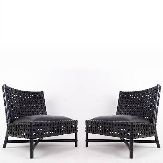 Pair of black woven leather lounge chairs