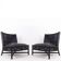 Pair of black woven leather lounge chairs