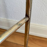 Gilded metal grid shelf in the shape of a vaulted arch