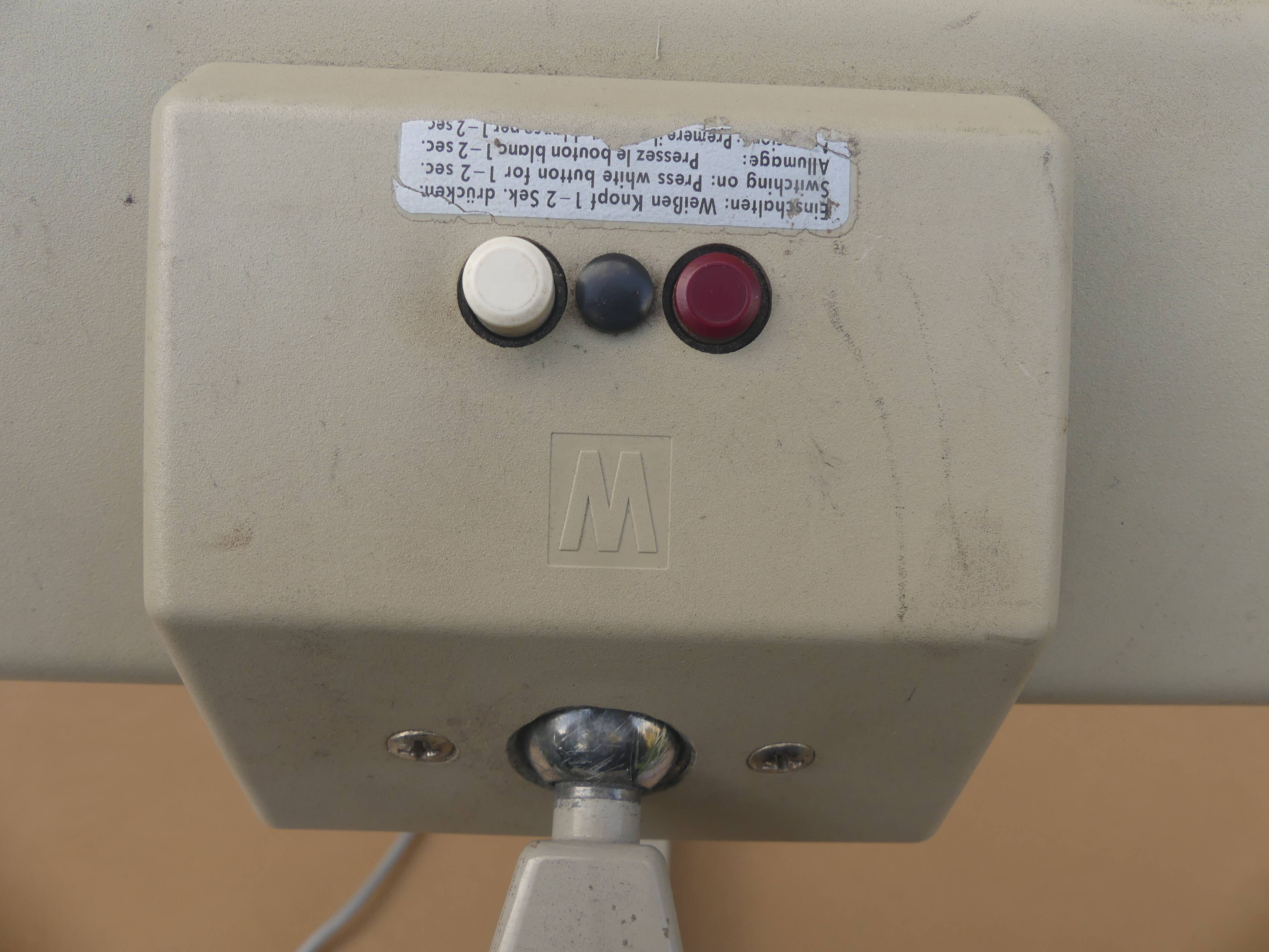 WALDMANN articulated workshop lamp with two industrial clamp arms for architects.