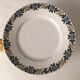 Limoges porcelain cake display with stylized floral motifs