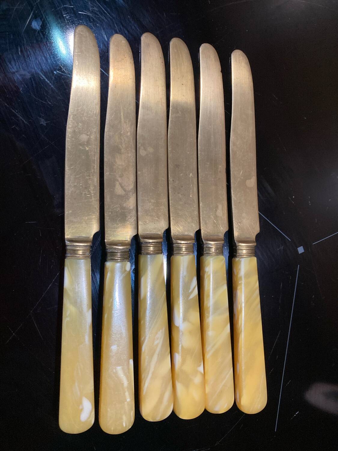 Yellow Bakelite dessert knives
