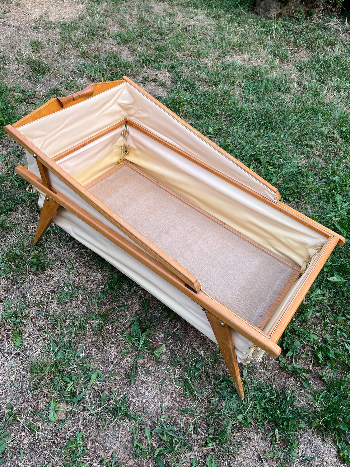 Wooden designer travel cot