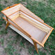 Wooden designer travel cot