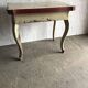 Rustic red and cream wooden dining table, moulded top, 1950s.
