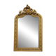 Large carved and gilded wooden mirror, rectangular in shape.