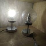 Duo of lamps in textured globe with a great play of light.