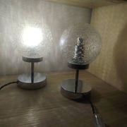 Duo of textured globe lamps with a large play of light.