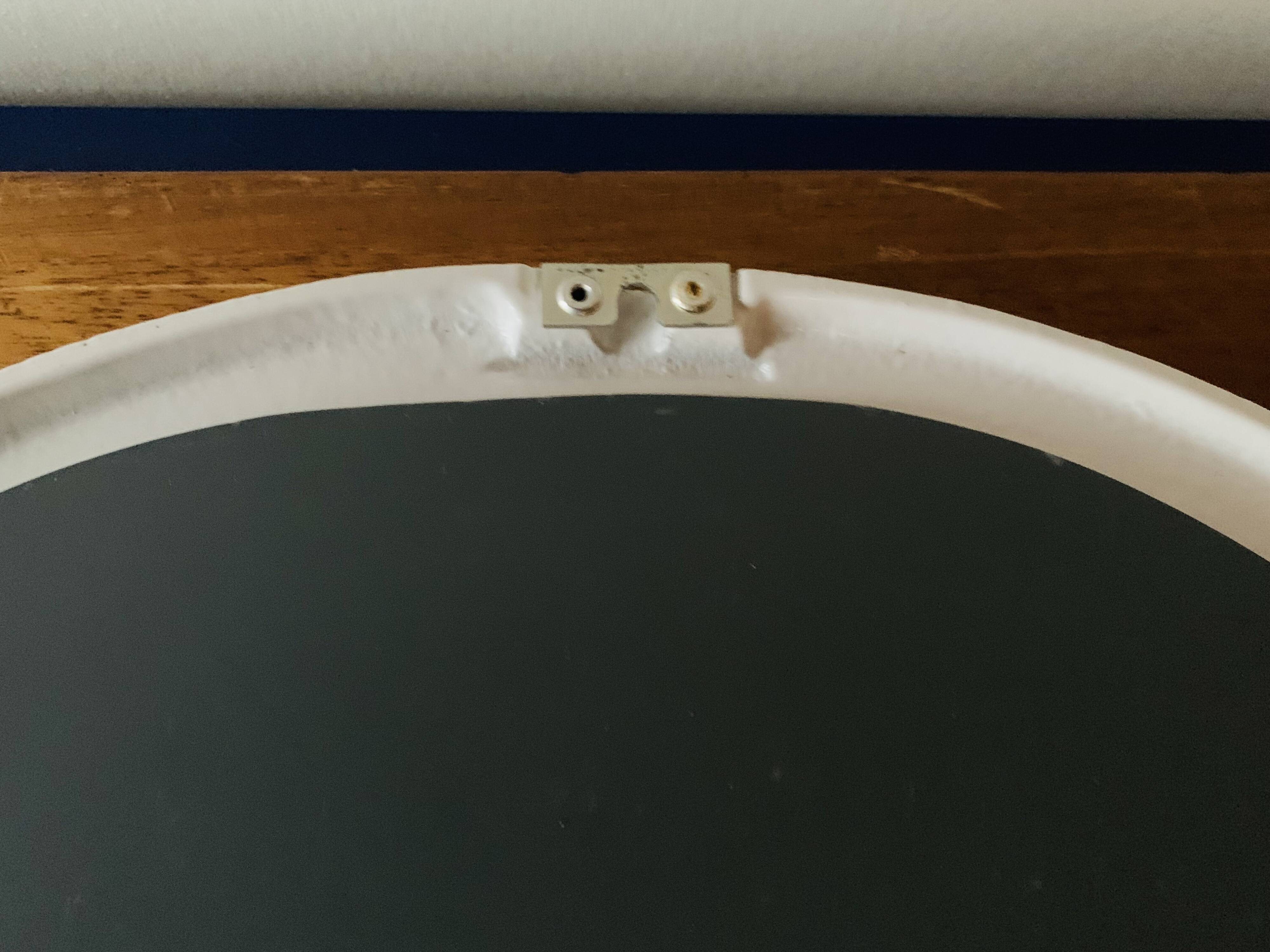 Oval mirror in vintage enameled white cast iron