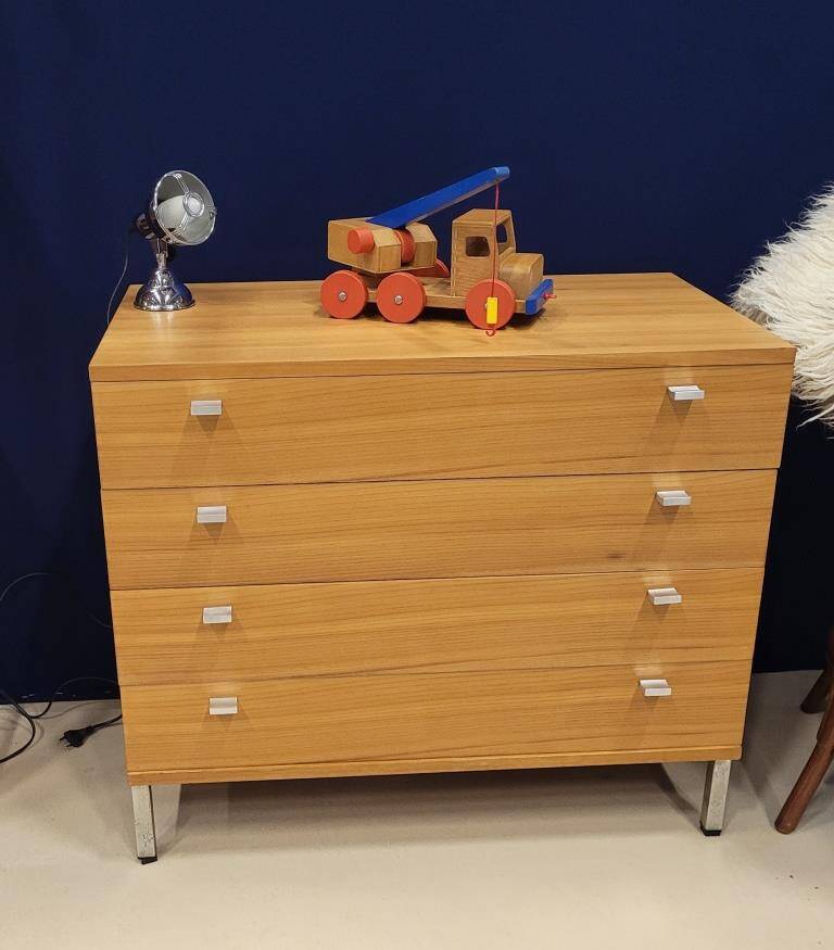 Solid wood chest of drawers with chrome legs from the 1970s.