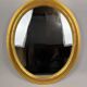 Miroir ovale vintage avec cadre en bois doré