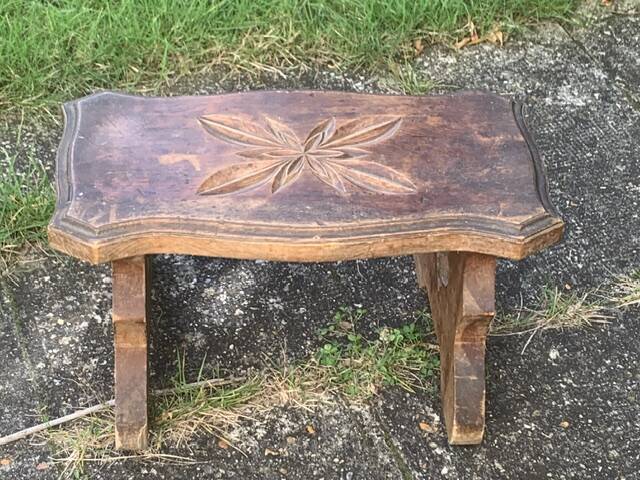 Bench in carved and varnished wood, mountain chalet decoration, old