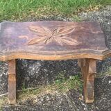 Bench in carved and varnished wood, mountain chalet decoration, old