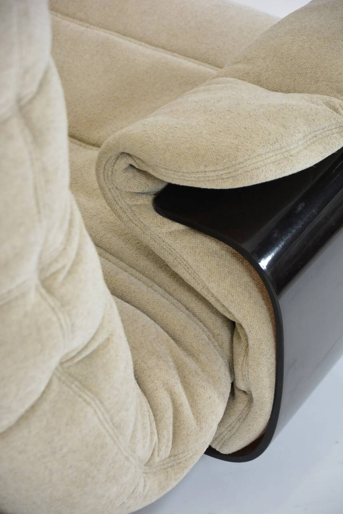 Marsala armchair and its light beige Ligne Roset footrest.